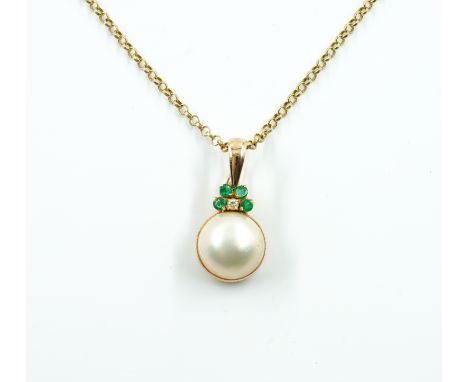 AN EMERALD AND PEARL PENDANTFeaturing a mabe pearl, with four round emeralds and one diamond decoration, on a 9ct gold belche