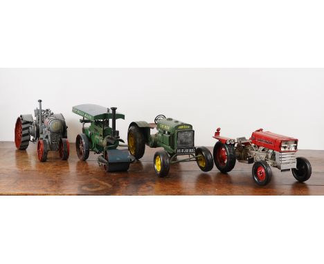 FOUR TIN-PLATE AGRICULTURAL VEHICAL MODELS INCLUDING A 1931 JOHN DEERE TRACTOR (4)20th Century/ModernThe John Deere 37cm long