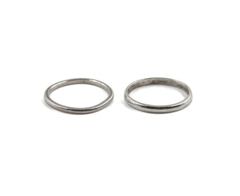 TWO PLATINUM WEDDING RINGS (2)The first detailed PLAT, ring size N, the second  detailed Platinum, ring size M and a half, co