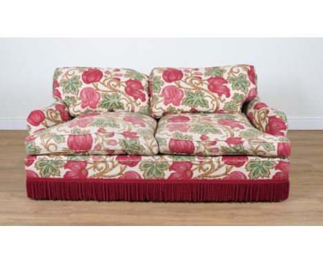 A TWO SEAT SOFAUpholstered in bold floral print with tassel fringe, 175cm wide; 66cm high