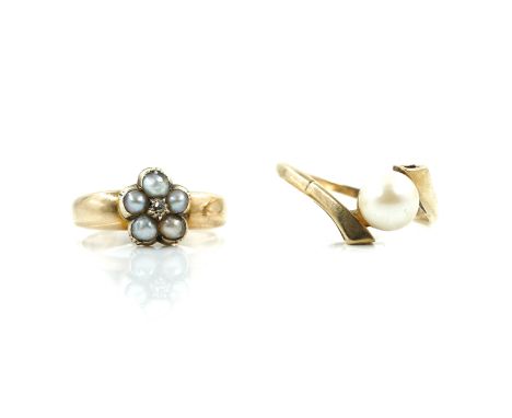 A GOLD, HALF PEARL AND DIAMOND RING AND ANOTHER GOLD AND CULTURED PEARL RING (2)The first ring designed as a flowerhead, moun