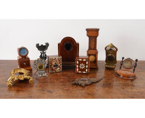 A COLLECTION OF NOVELTY POCKET WATCH STANDS INCLUDING ONE MODELLED AS A LONGCASE CLOCK (11)Various datesThe clock 25.5cm high