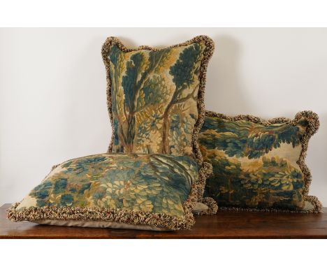 THREE NORTH EUROPEAN VERDURE TAPESTRY FRAGMENT CUSHIONS (3)18th Century With fringed borders, 72cm long; 43cm high