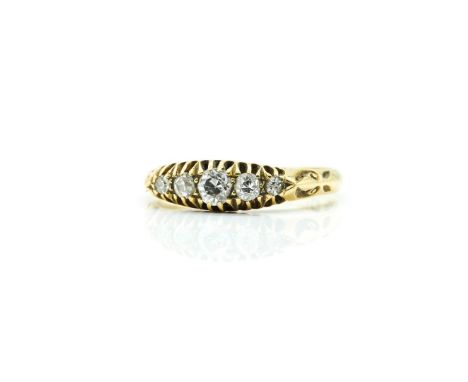 AN 18CT GOLD AND DIAMOND FIVE STONE RINGMounted with a row of graduated cushion shaped diamonds, Birmingham (date letter rubb