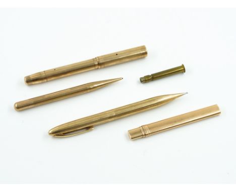 FOUR GOLD CASED WRITING IMPLEMENTS (4)Comprising; a Swan Mabie Todd and Co 9ct gold cased fountain pen, London 1938, a 9ct go