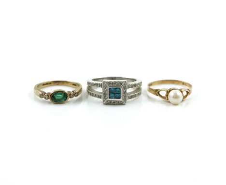 A TREATED BLUE DIAMOND AND DIAMOND RING AND TWO 9CT GOLD AND GEM SET RINGS (3)The first mounted with four square cut treated 