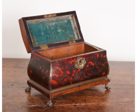 A 19TH CENTURY GILT METAL MOUNTED TORTOISESHELL TEA CADDYWith sprung loaded side drawer, 25cm wide; 15cm deep; 18cm high