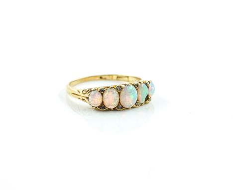 A GOLD AND OPAL FIVE STONE RINGMounted with a row of graduated oval opals and with four pairs of diamond points mounted at in