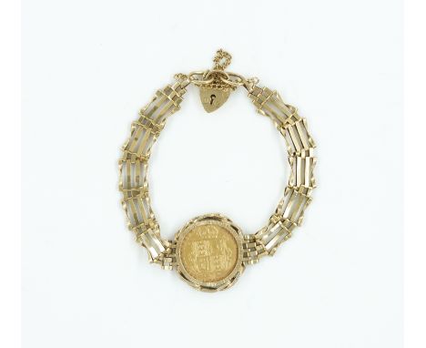 A HALF SOVEREIGN BRACELETSet with a Victoria 1892 half sovereign, mounted into a gate bracelet with a heart padlock, in hallm