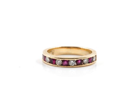 A GOLD, RUBY AND DIAMOND ELEVEN STONE HALF HOOP ETERNITY RINGMounted with six circular cut diamonds, alternating five circula