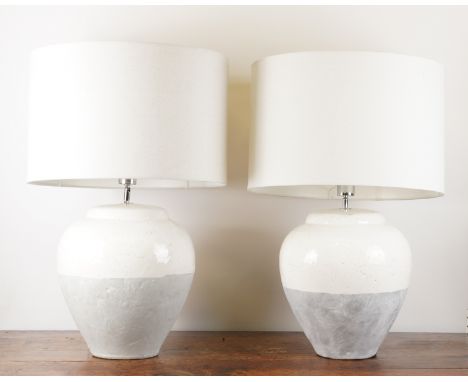 A PAIR OF LARGE MONOCHROME CERAMIC LAMPS AND A DIMPLED GLASS LAMP (3)ModernThe pair of white and grey glazed lamps in baluste