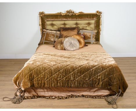 PROVASI: A SUPER KING SIZE BED WITH GILT FRAME RIBBON TIED UPHOLSTERED HEADBOARDThe headboard 202cm wide; 163cm high, 220cm l