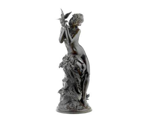 Mathurin Moreau (French, 1822 -1912): A patinated bronze figure of a young girl holding a birdthe semi clad figure seated on 