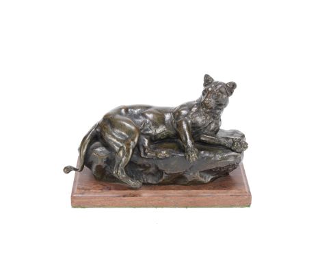 Charles Valton (French, 1851-1918): A patinated bronze model of a lionessthe recumbent cat on a rockwork base, signed Valton 