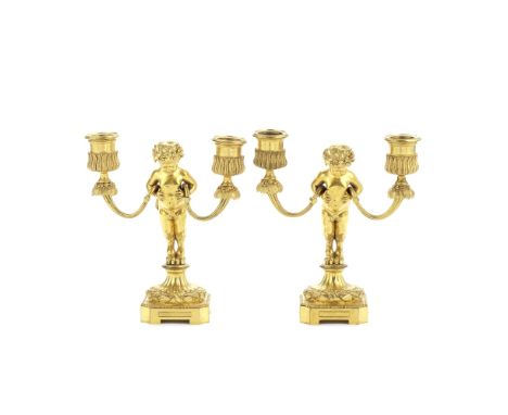Henri Dasson (French, 1825-1896): A pair of late 19th century gilt bronze dwarf figural candelabrathe acanthus and floral cas