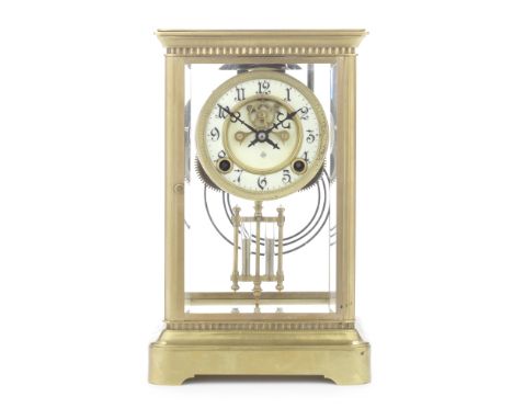 An early 20th century French brass four glass clockthe plain rectangular case with moulded cornice above a narrow vertical re