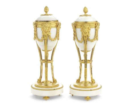 A pair of 19th century French gilt bronze and white marble cassolettesin the Louis XVI stylethe ovoid bodies with domed cover