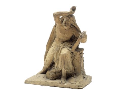 An early 19th century terracotta figure of Mosesprobably Frenchthe seated figure semi-clad in a flowing cloak and drapery, ho