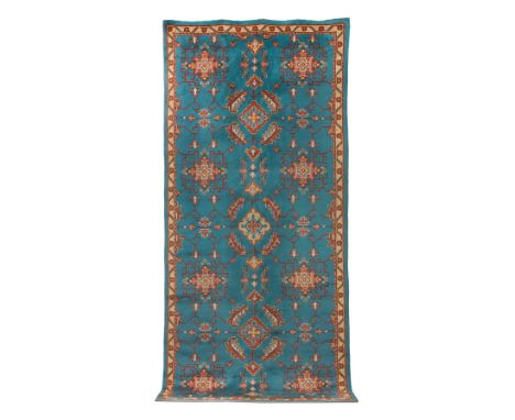 An unusual Indian carpeton light blue ground with charming geometric motifs,433cm x 199cmThis lot is subject to the following