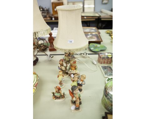 A COLLECTION OF GOEBEL FIGURINES, A TABLE LAMP AND SIX FIGURES 