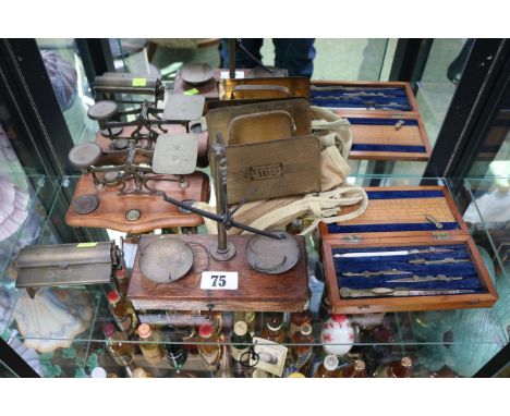 Brass Postage weighing Balance, Travelling scales, Draughtsman's set, Brass cigarette roller, Forensic examining set and a le