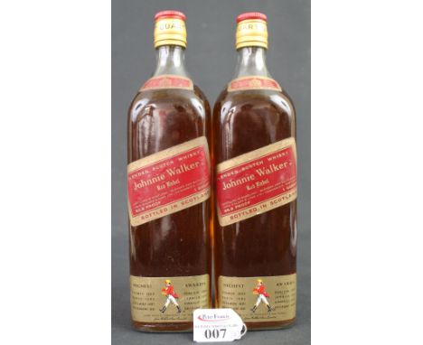 Two bottles of Johnnie Walker Red Label blended scotch whisky, distilled in Scotland, blended and bottled by John Walker and 