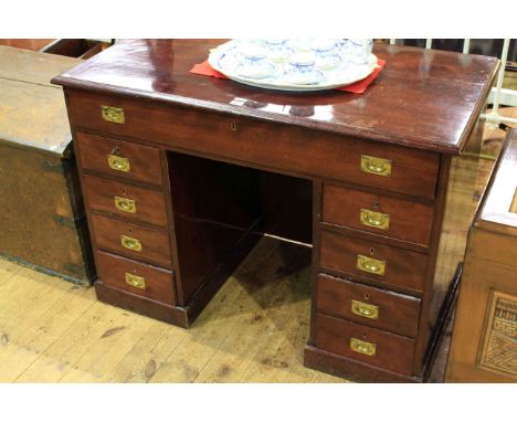 Mahogany campaign style nine drawer pedestal desk