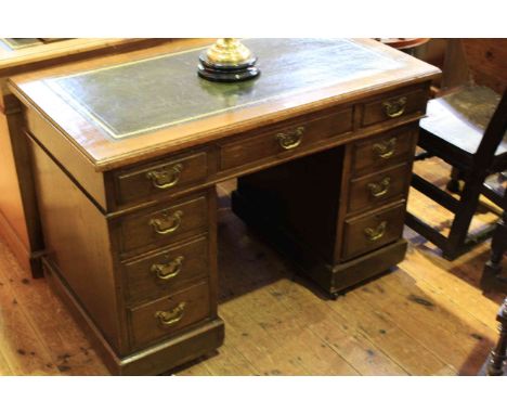 Early 20th Century oak nine drawer pedestal desk