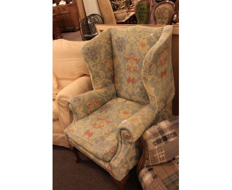 Peter Hall wing easy chair on ball and claw legs in tapestry fabric