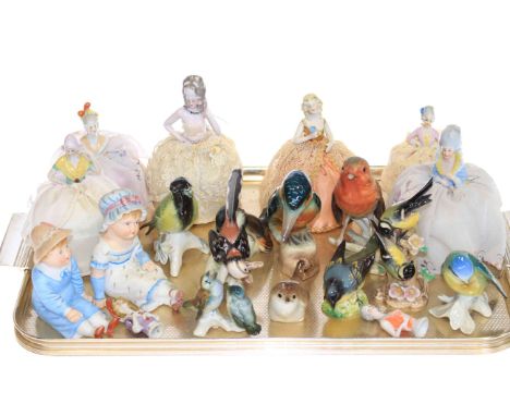 Six pin cushion ladies, Goebel, Beswick and Continental birds and pair of bisque seated figures