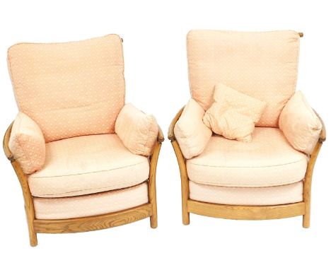 A pair of Ercol Renaissance light elm armchairs, with loose cushion seats and backs, 88cm wide.