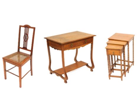 An oak nest of occasional tables, the smallest with a single frieze drawer, raised on bobbin turned supports united by a box 