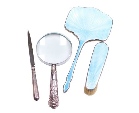 A George VI silver and turquoise guilloche enamel hand mirror, together with a clothes brush, magnifying glass with silver Ki