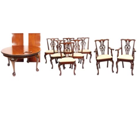 A Georgian style mahogany wind out dining table, with two additional leaves, raised on cabriole legs on ball and claw feet, 7