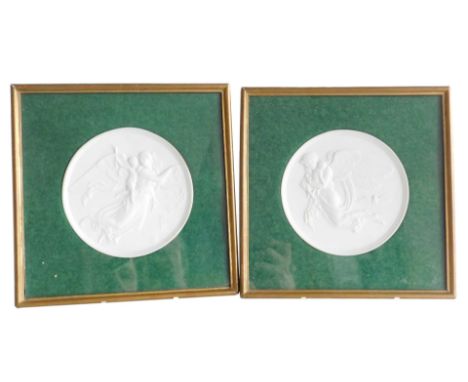 A pair of Bing &amp; Grondahl bisque circular porcelain plaques, emblematic of The Night, and The Day, designed by Bertl Thor