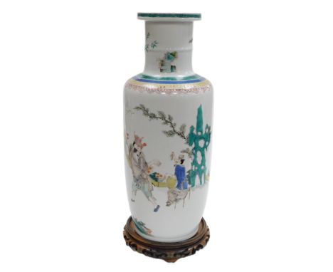 A Qing Dynasty Chinese porcelain famille verte rouleau vase, in Kangxi style, painted with figures in an interior at a games 