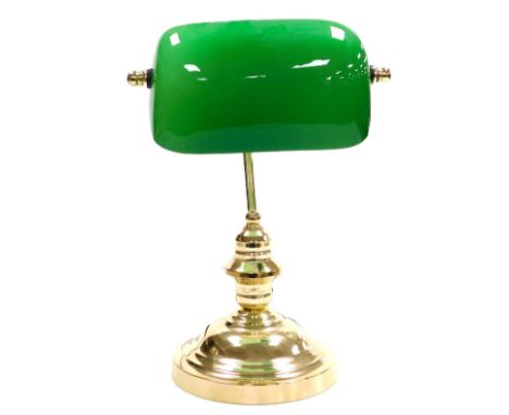 A brass desk lamp, with an angular green and white glass shade, 37cm high. 