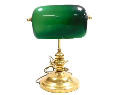 A brass desk lamp, with an angular green and white glass shade, 35cm high. 