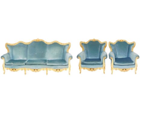 A continental Baroque style cream and parcel gilt three piece suite, upholstered in blue draylon, raised on cabriole legs, co