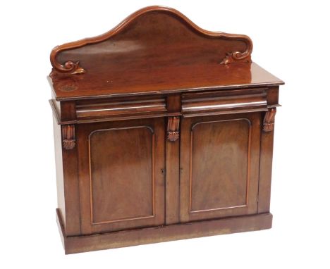 A Victorian mahogany chiffonier, with a shaped back over two cushion drawers, above cupboard doors, raised on a plinth base, 