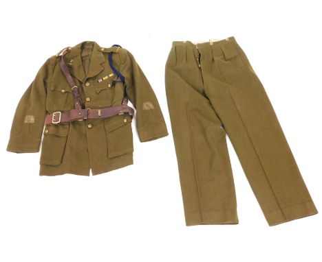 A WWI British Army No.1 khaki officer's dress uniform, with Royal Signals insignia, comprising tunic and trousers, the tunic 