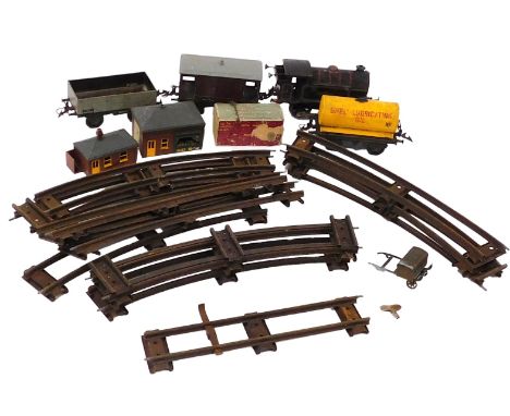 A Hornby O gauge railway, including a type 40 tank engine, four wagons, track, and two Tri-ang trackside buildings. 