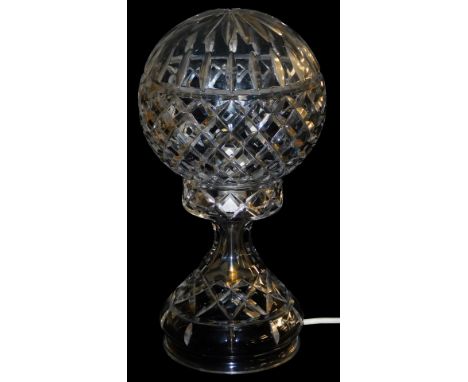 A cut glass table lamp and cover, the cover of globe form, 32cm high. 