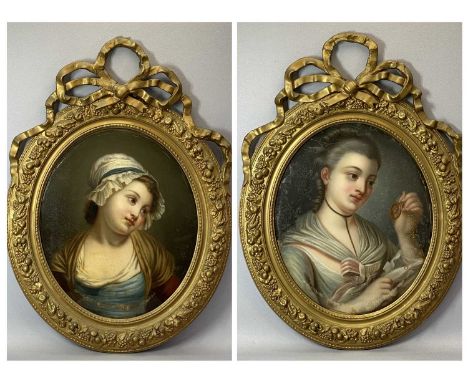 19TH CENTURY OVAL PORTRAITS, a pair - reverse painting on convex glass depicting two pensive young girls, believed original f