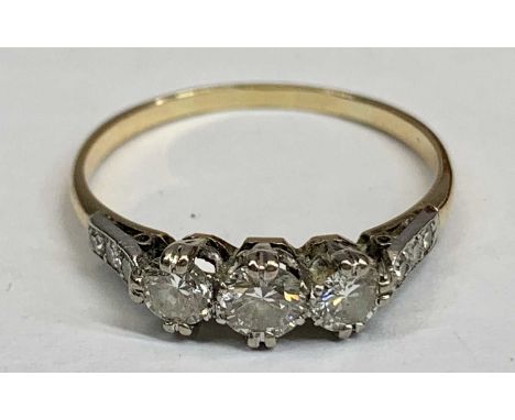 AN UNMARKED, BELIEVED, GOLD &amp; PLATINUM 9 STONE DIAMOND RING - having a central 0.25ct diamond, flanked by 2 x 0.20ct diam