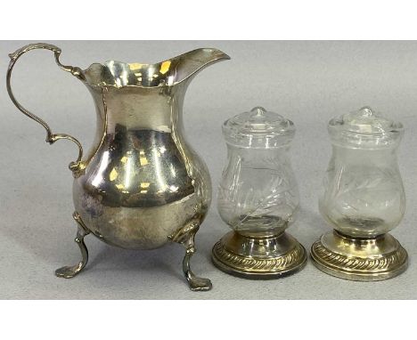 SMALL TABLE SILVER - 3 items to include a scroll handle, three footed cream jug, London 1936, Maker William Comyns &amp; Sons