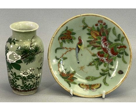 A CHINESE EXPORT CELADON CIRCULAR SHALLOW DISH painted in famille rose with blossom, bird and butterfly, seal mark on reverse