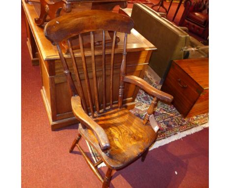 A provincial fruitwood stick back open armchair with solid seat on ring turned supports
