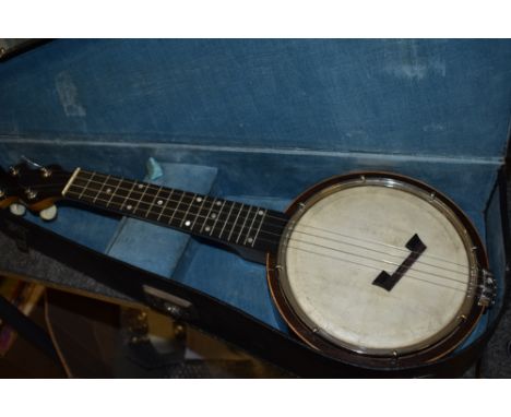 A vintage banjo ukulele, labelled to reverse of headstock for Clifford Essex