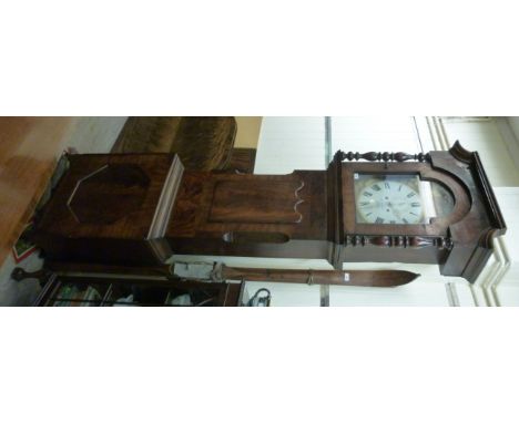 An early Victorian mahogany longcase clock, the hood having turned pillars, over canted flanks and a panelled box base, raise